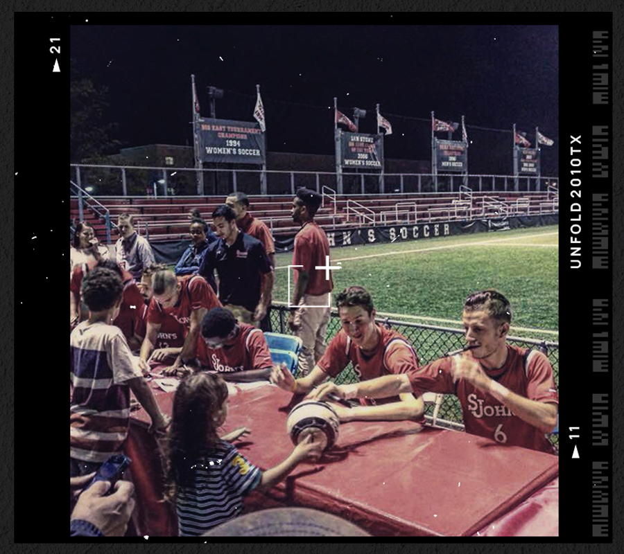 Signing autographs at St John's University